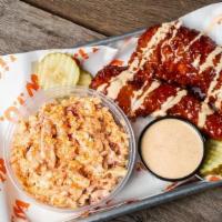 Nashville Hot Tenders Slaw/Corn Meal · 2 large crispy Nashville Hot-style chicken tenders served w/ pickle chips, chipotle ranch an...