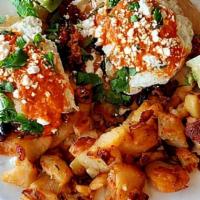 Huevos Rancheros · two eggs over served on two crispy corn tortillas, chorizo, black beans, salsa, avocado, cil...