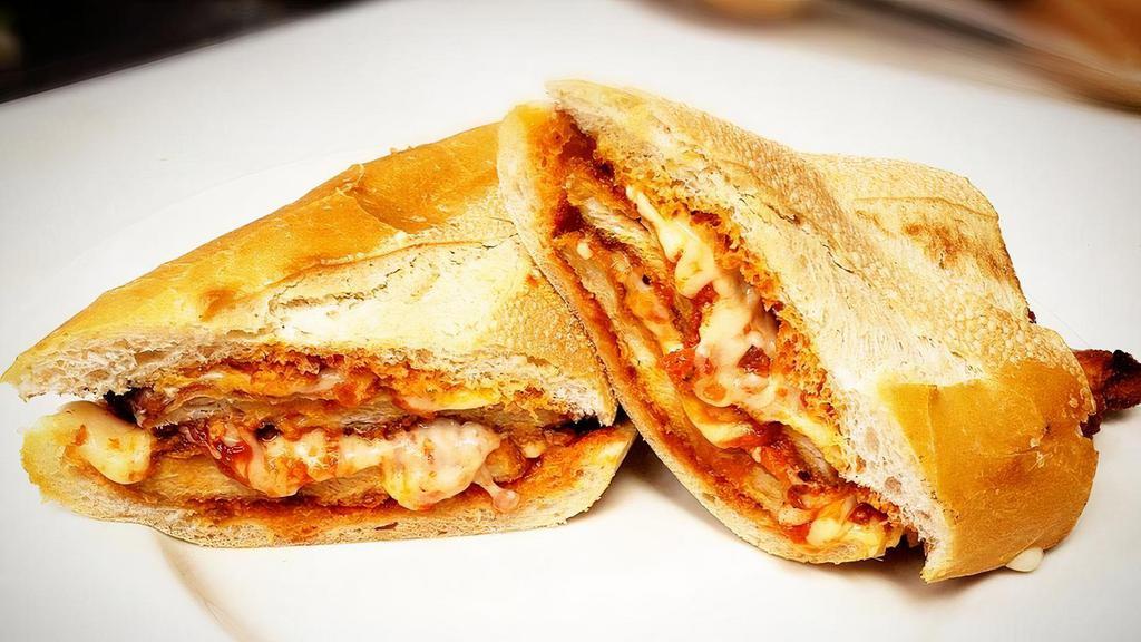 Chicken Parmesan · homemade chicken cutlet and marinara sauce, topped with melted mozzarella on a toasted 1/2  sub roll.