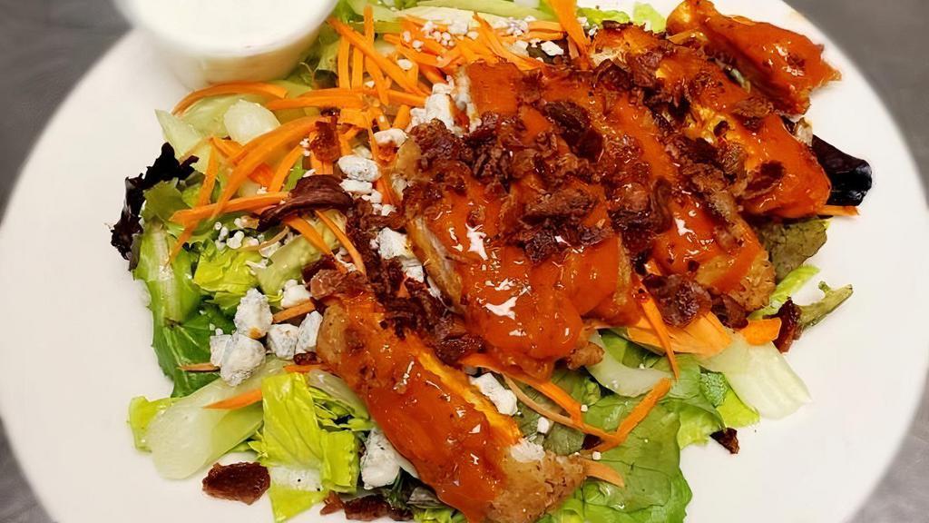 Buffalo Chicken Salad · crispy breaded chicken tossed in buffalo sauce, crumbled bacon, tomatoes, celery, carrots, onions, bleu cheese dressing. *** all dressings come on the side***