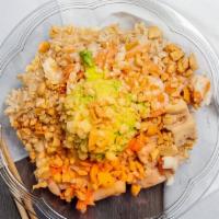 Sesame Ginger Chicken · Chicken, sweet onions, and shredded carrots tossed in sesame ginger, and topped with avocado...