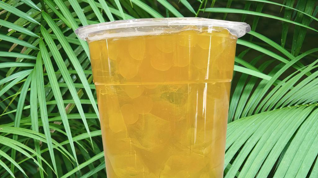 Apple Lychee Tea · Green tea, green apple syrup, lychee, passion fruit boba pearls - 22oz