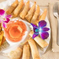 Lotus Sampler Platter · Combination of 4 chicken satay, 6 paper shrimps and 4 veggie spring rolls