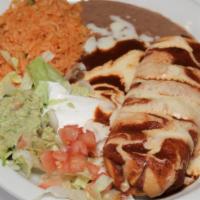 Chimichangas · Two flour tortillas, soft, or fried, filled with ground beef or chicken or pork, beans, lett...