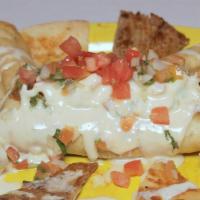 Burrito Special · One beef burrito served with lettuce, sour cream, tomatoes, and beans.
