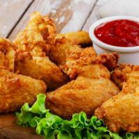 Chicken Wings · Golden, crispy fried wings.