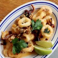 Calamar Al Ajillo · crisp Rhode Island squid, garlic, guajillo chile, parsley, lemon.
