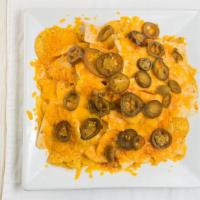 Vintage Nachos & Cheese · Topped with melted Cheddar cheese.