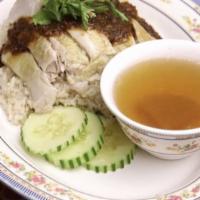 Grandma'S Chicken Over Rice · Steamed boneless chicken served over perfuming garlic rice topped with spicy ginger and soyb...