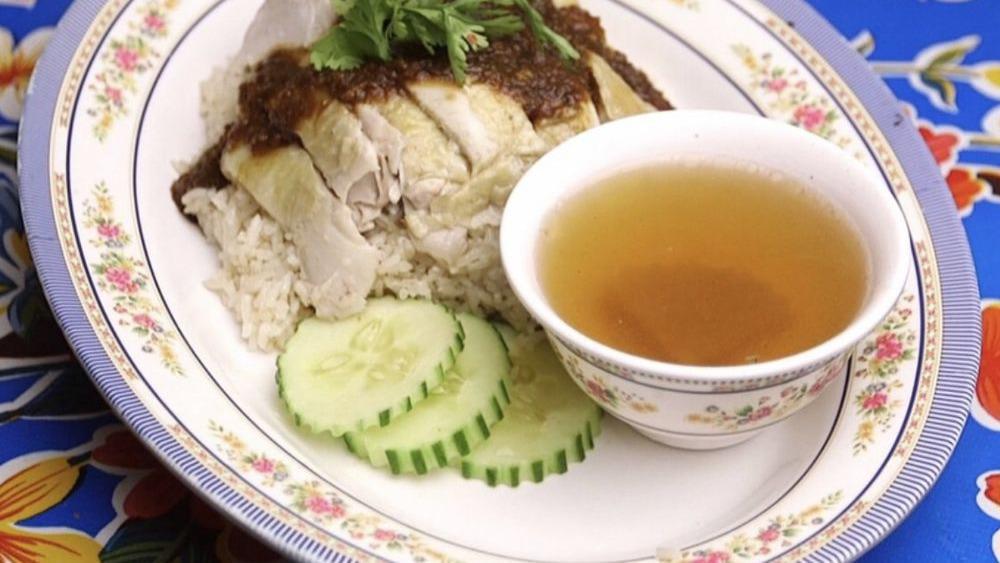 Grandma'S Chicken Over Rice · Steamed boneless chicken served over perfuming garlic rice topped with spicy ginger and soybean sauce. Served with a side of soup.