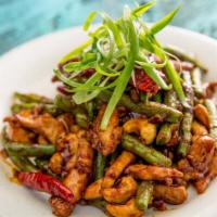 Szechuan Chicken · Sauté chicken in a spicy brown sauce with Szechuan peppers, green beans, cashew nuts, scalli...