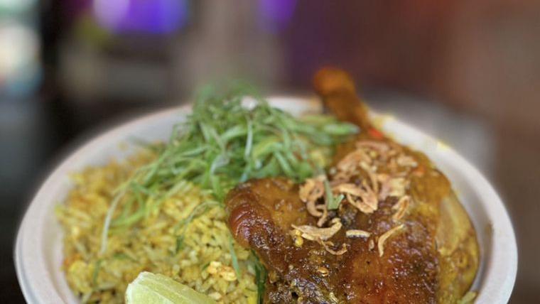 Duck N’ Rice · Fall of the bone duck leg confit served with aromatic turmeric, raisin, coconut rice and cashew nuts.