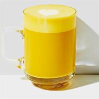 Turmeric Latte (Gf) · We combine cold-pressed turmeric and ginger roots with a hint of honey as a base, then steam...