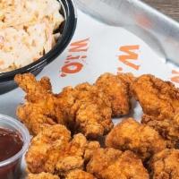 Dip Em 'Nuggz Slaw/Corn Meal · 10 Boneless nuggz, served with a side of dipping sauce, with your choice of seasoned fries, ...