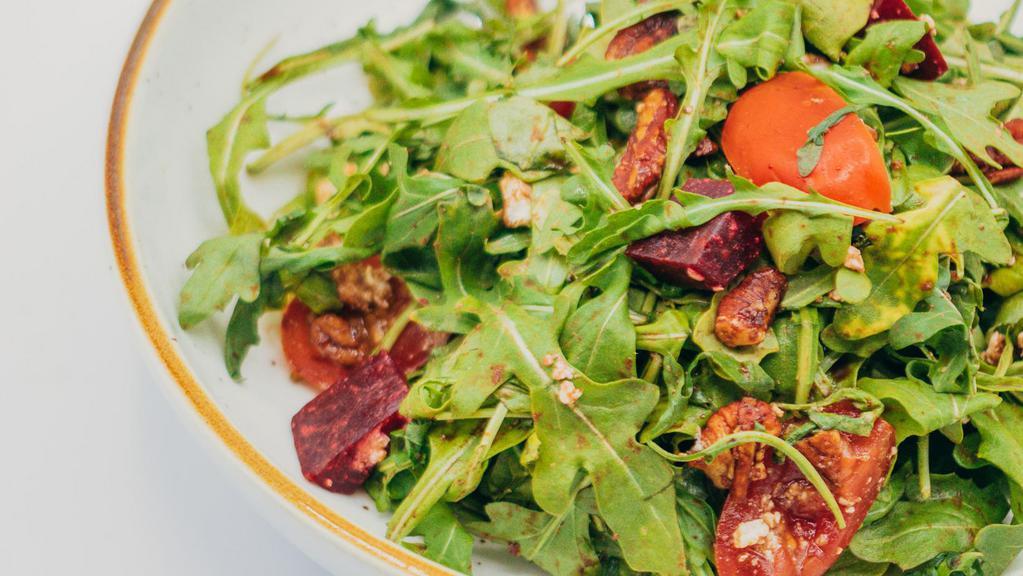 Arugula Salad · Gluten-free, Vegetarian, New! Arugula, Cherry Tomato, Beets, Candied Pecans, Feta Cheese, Balsamic Dressing.