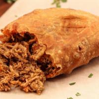 Pollo Mole Empanada · Pulled Chicken, Mole Sauce, Spicy and contains Nuts