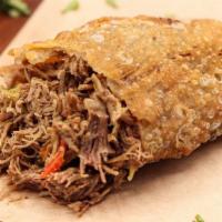 Philly Empanada · Braised Pulled Beef, Cheddar Cheese, Onions, Peppers