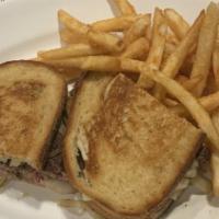 Patty Melt · Two slices of rye bread, grilled melted cheese, fried onions, and a hamburger.