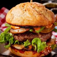 Grilled Portobello Mushroom Burger · Juicy mouth-watering meat patty with grilled portobello mushrooms, crispy lettuce, raw sweet...