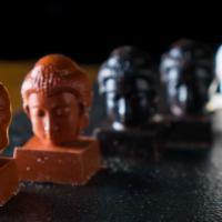 Tao Chocolate Buddhas · Six Assorted White, Milk, and Dark Chocolates.