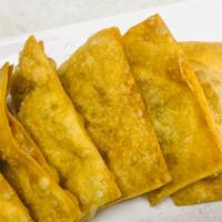 Fried Wonton (6 Pieces) · Deep-fried folded wonton with a seasoned pork filling (comes with a sweet and sour dipping s...