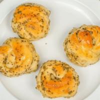 Garlic Knots · Bread, topped with garlic & olive oil or butter, herb seasoning, baked to perfection. Melts ...