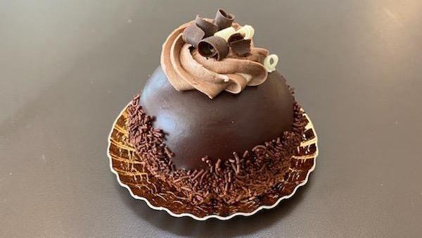 Dark Chocolate Mousse · A cookie base filled with chocolate mousse, coated in chocolate.