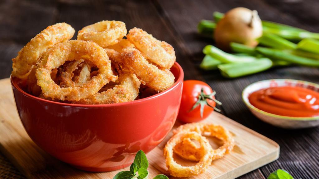 Onion Rings · Golden-crispy onion rings salted and fried to perfection.
