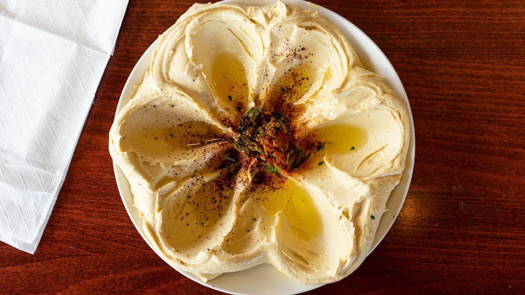 Hummus · With nachos and bread.