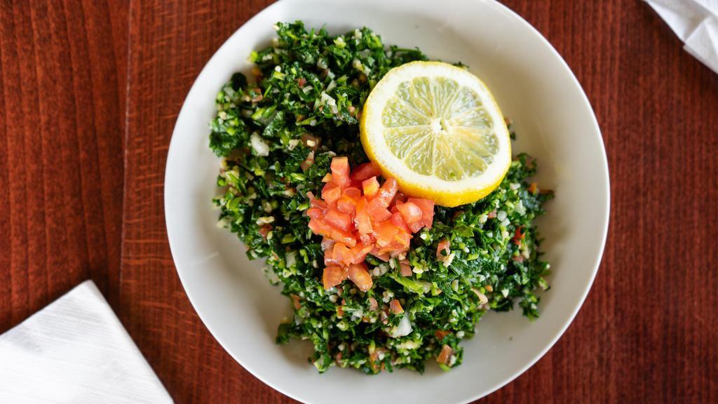 Tabbouleh · Levantine salad made mostly of finely chopped parsley, with tomatoes, mint, onion, and bulgur, and seasoned with olive oil, lemon juice, salt