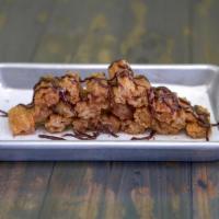 Churro Bites · Warm fried churros tossed in cinnamon sugar coat and cut into bite sized chunks, served with...