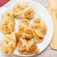 Jumbo Garlic Knots (6) · served with a side of tomato sauce