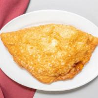 Calzone · Our calzones are deep fried with ricotta and mozzarella cheese, served with a side of tomato...