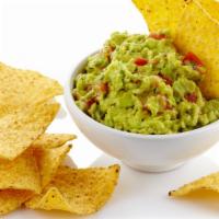 Chips & Guacamole · Delicious, corn tortilla chips, served with a homemade guacamole.