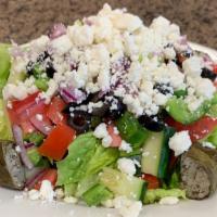 Greek Chopped Salad · Mixed field greens with peppers, tomatoes, olives, cucumbers, onions, feta cheese, grape lea...