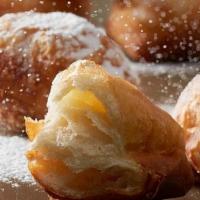 Croissant Beignet · Our Croissant Beignet is a flaky spin on the traditional beignet. As a feature in homestyle ...