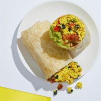 Vegan Mexican Breakfast Burrito · Scrambled tofu with sauteed peppers and onions, black beans, pico de gallo, and avocado in a...