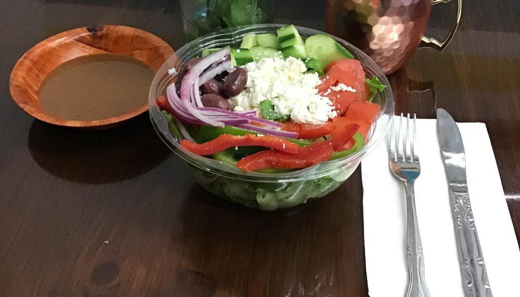 Greek Salad. · Romaine lettuce, tomatoes, cucumbers, green peppers, onions, olives, feta cheese . Dressing on the side