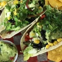 Vegetarian Tacos. · Shredded lettuce, black beans, corn, onion, mixed peppers,cilantro, guacamole. Your choice o...