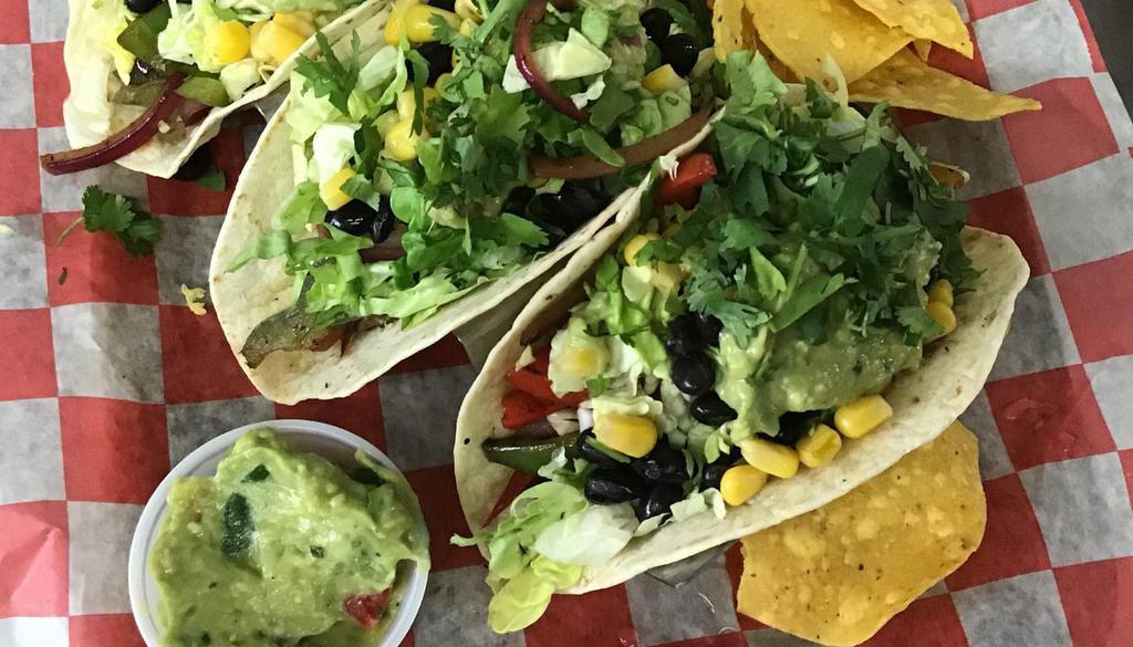 Vegetarian Tacos. · Shredded lettuce, black beans, corn, onion, mixed peppers,cilantro, guacamole. Your choice of home made salsa. And nachos.