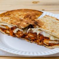 Tex-Mex Chicken Panini · Grilled chicken, cheddar and Monterrey Jack cheeses, sauteed onions and BBQ sauce.