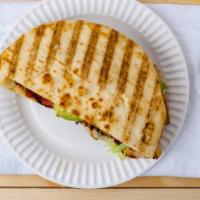 Chicken Fajita Panini · Grilled chicken, cheddar cheese, roasted peppers, onions, and salsa sauce.