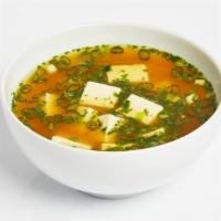 Miso Soup · Traditional miso soup with seaweed, tofu, and scallions.