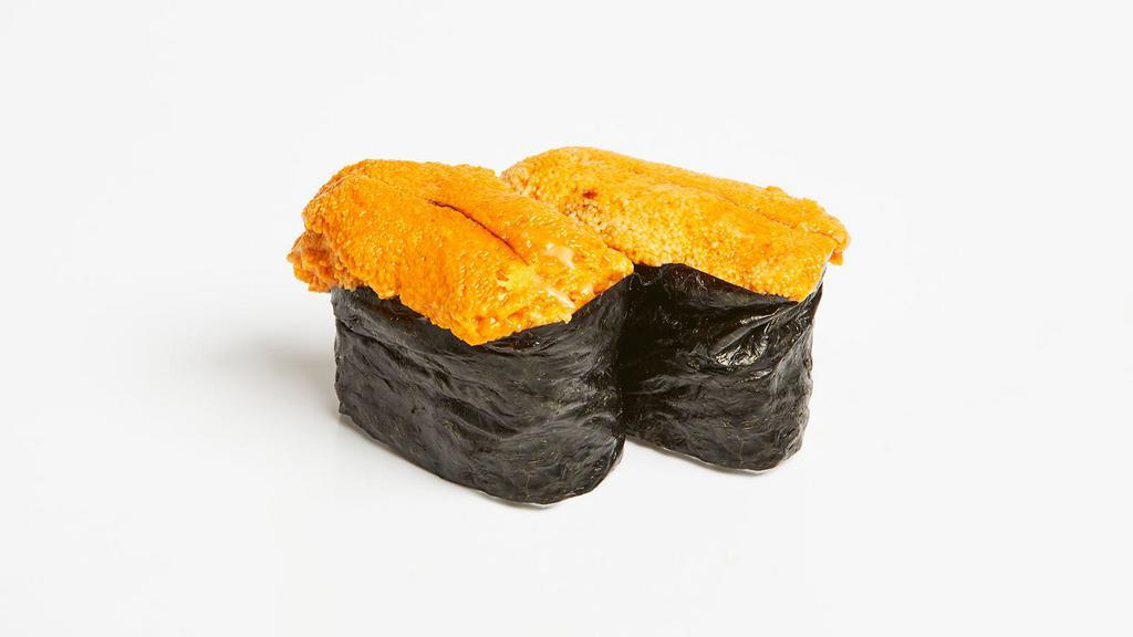 Uni Nigiri · Two pieces of uni over pressed sushi rice.