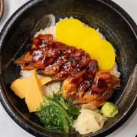 Unagi Don  · 7 pcs Smoke eel Over sushi rice w. Pickles & Greens
