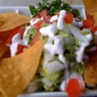 Guacamole & Chips · Housemade guacamole served with corn chips.