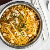 Chicken Biryani · Aromatic basmati rice cooked with chicken & enhanced with traditional Indian spices