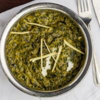 Palak Paneer · Indian cottage cheese cubes cooked along with smooth spinach gravy & enhanced with cream & s...