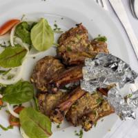 Lamb Chop · Tender bone-in lamb meat chops marinated in strained yogurt and flavorsome masalas, roasted ...