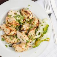 Chicken Malai Tikka · Mouthwatering juicy grilled boneless chicken pieces made with marination of fresh cream, che...